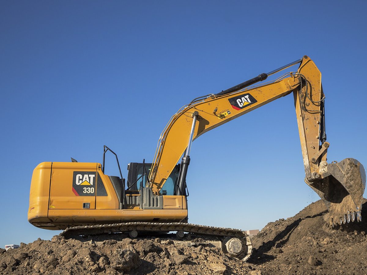 An excavator doing site work